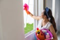 girl clean window by microfiber fabric