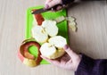 The girl cleaned and cut the apple with a knife. Healthy food Royalty Free Stock Photo