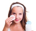 Girl cleaning her face with tonic lotion Royalty Free Stock Photo