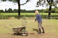 Girl cleaning the manure