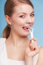 Girl cleaning tongue. Dental care oral hygiene.