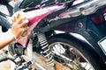 Girl cleaning and Washing the Pink motorcycle