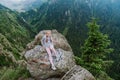 Girl on the cliff edge near Transfegerasan mountain road. Royalty Free Stock Photo