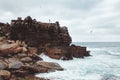 Girl on cliff near sea Royalty Free Stock Photo