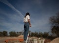 Girl climb a ladder in an industrial outside Royalty Free Stock Photo