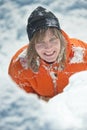 Girl climber climbs a snow cornice using ice axes through snow blown away by the strong wind. Royalty Free Stock Photo