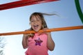 Girl on climbing frame Royalty Free Stock Photo
