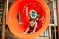 Girl climbing the maze in children game center