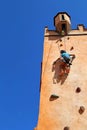 Girl climbing rock wall Royalty Free Stock Photo