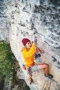 Girl climbing a rock. Royalty Free Stock Photo