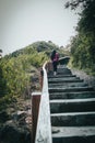 Girl climbing a rural stairway