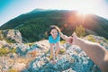 A girl is climbing a stone