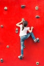 Girl climbing a wall in a playground Royalty Free Stock Photo