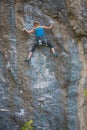 The girl climbs the rock. Royalty Free Stock Photo