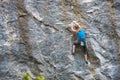 The girl climbs the rock. Royalty Free Stock Photo