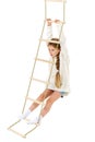 Little girl plays on a rope ladder. Royalty Free Stock Photo