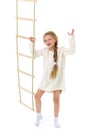Little girl plays on a rope ladder. Royalty Free Stock Photo