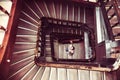 Girl climbs a spiral staircase. Directly above Royalty Free Stock Photo