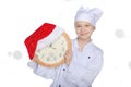 Girl with clock, Santa hat and snow Royalty Free Stock Photo