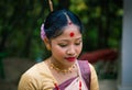 Girl close up portrait isolated dressed in traditional wearing on festival with blurred background