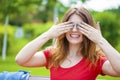 Girl closes eyes with her hands Royalty Free Stock Photo