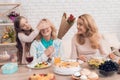 The girl closes eyes to her grandmother. She wants to make a surprise.