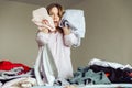girl with clothes in her hands. During ironing at home Royalty Free Stock Photo