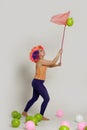 Girl clown and balloons Royalty Free Stock Photo