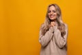 the girl is coaxing and surrounded by a yellow background