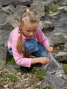 Girl collecting mussels Royalty Free Stock Photo