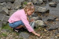 Girl collecting shells by sea