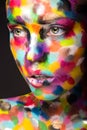 Girl with colored face painted. Art beauty image Royalty Free Stock Photo