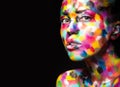 Girl with colored face painted. Art beauty image