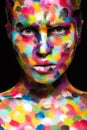 Girl with colored face painted. Art beauty image
