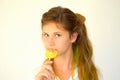 Girl with colored strands and with a lollipop