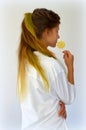 Girl with colored strands and with a lollipop