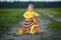 Girl with colorful dress on the bicycle