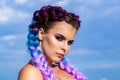 Girl colorful kanekalon braided in her hair. Pretty woman colorful violet ombre hair and pro makeup. Girl braids on