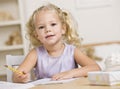 Girl Coloring in Books Royalty Free Stock Photo