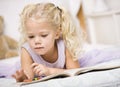 Girl Coloring in Books Royalty Free Stock Photo