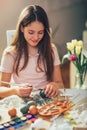 Girl coloring eggs for Easter Royalty Free Stock Photo