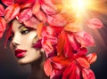 Girl with colourful autumn leaves hairstyle Royalty Free Stock Photo
