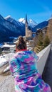 Heiligenblut - A girl adrmiring a church in the Alpine valley