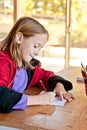 Girl with colouring page, drawing Royalty Free Stock Photo