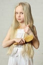 Girl combing hair Royalty Free Stock Photo