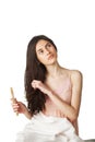 Girl combing hair and looking up Royalty Free Stock Photo