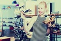 Girl comparing shoes in store Royalty Free Stock Photo