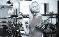 Girl comparing shoes in store Royalty Free Stock Photo