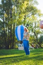 Girl compete in a relay race . Jumping in bags . They laugh and fall . Royalty Free Stock Photo