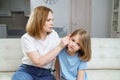 a girl complains of pain in ear and her mother examines it. children& x27;s diseases.